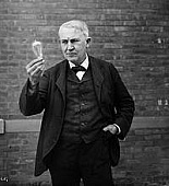 Edison with his most influental invention, the light bulb. 